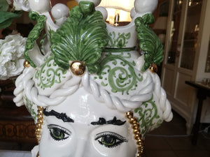 Green female Head of Moro with pure gold