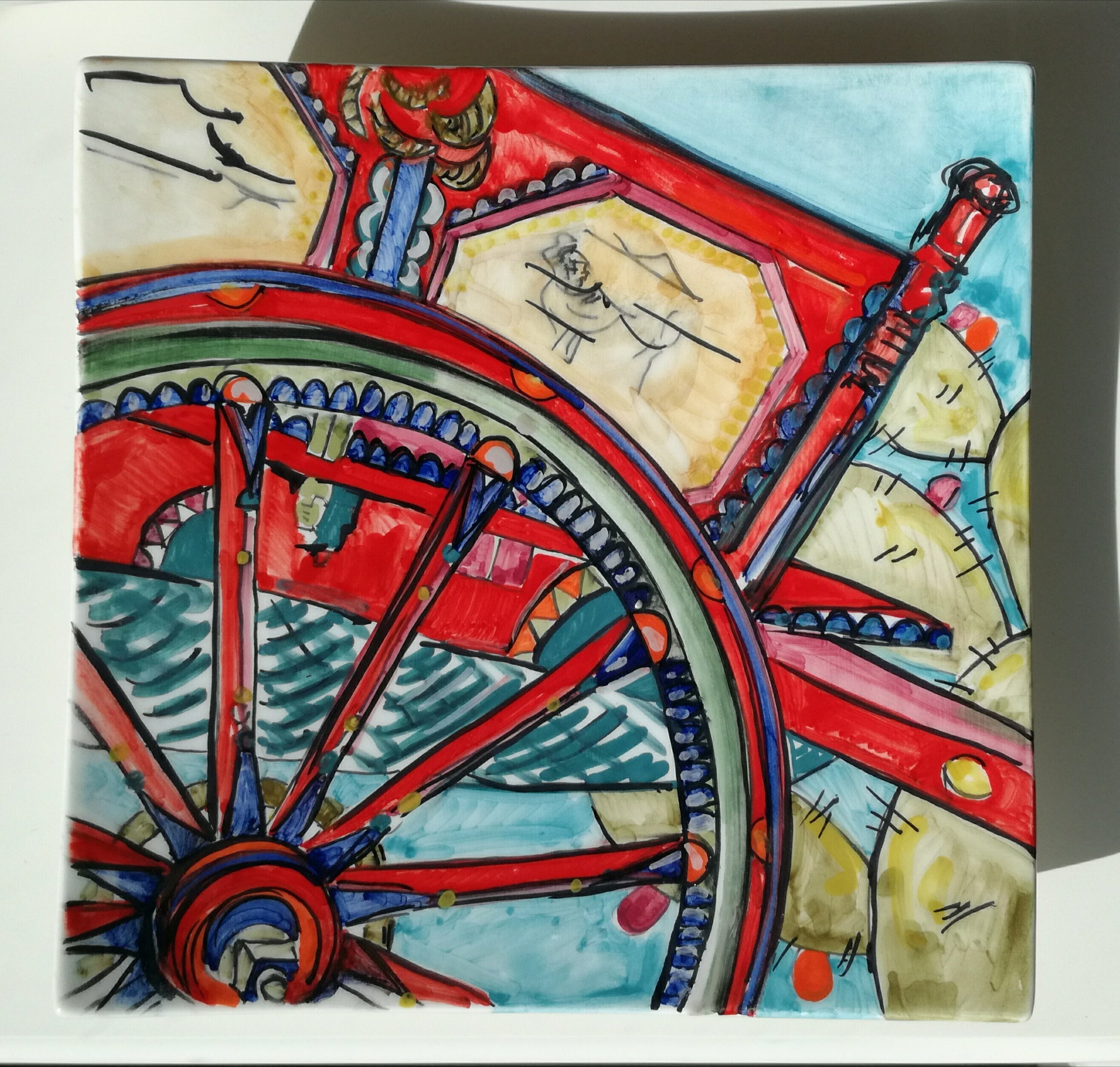 Pocket emptier plate with Sicilian cart wheel