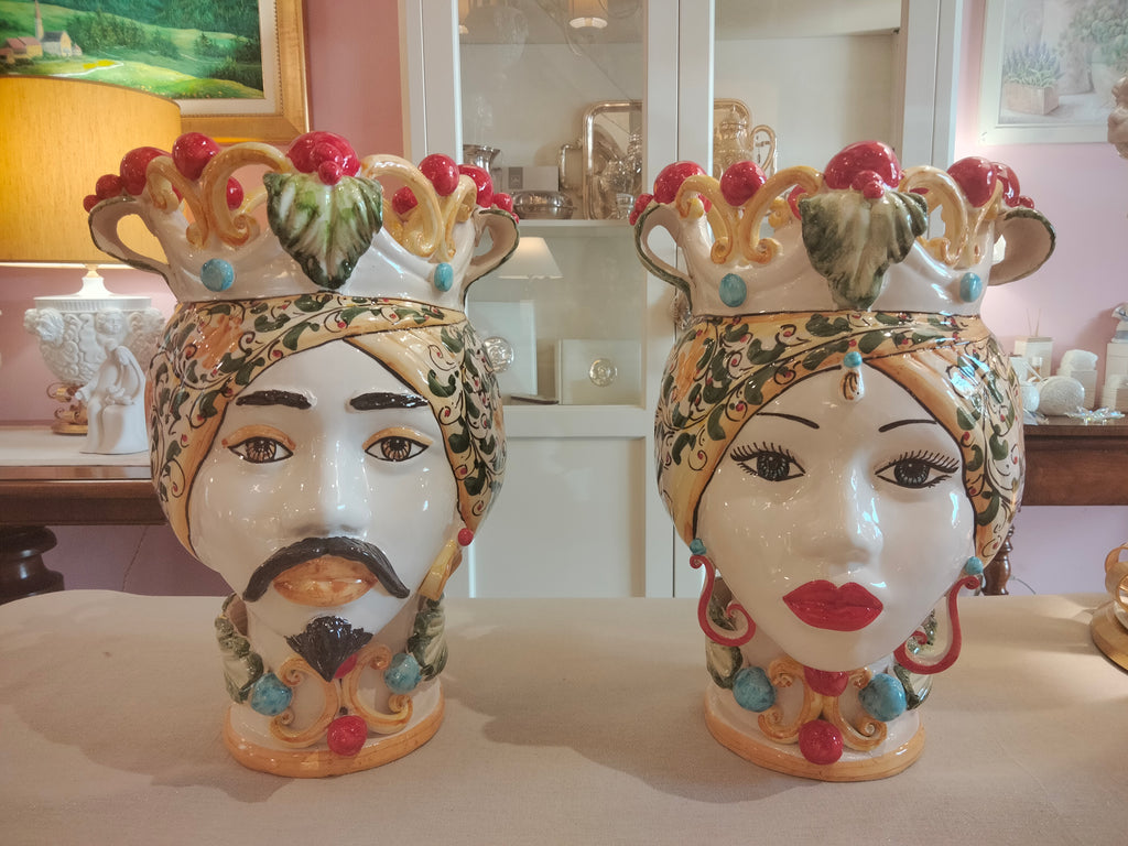 Pair of Moor's heads with pierced crown and knobs