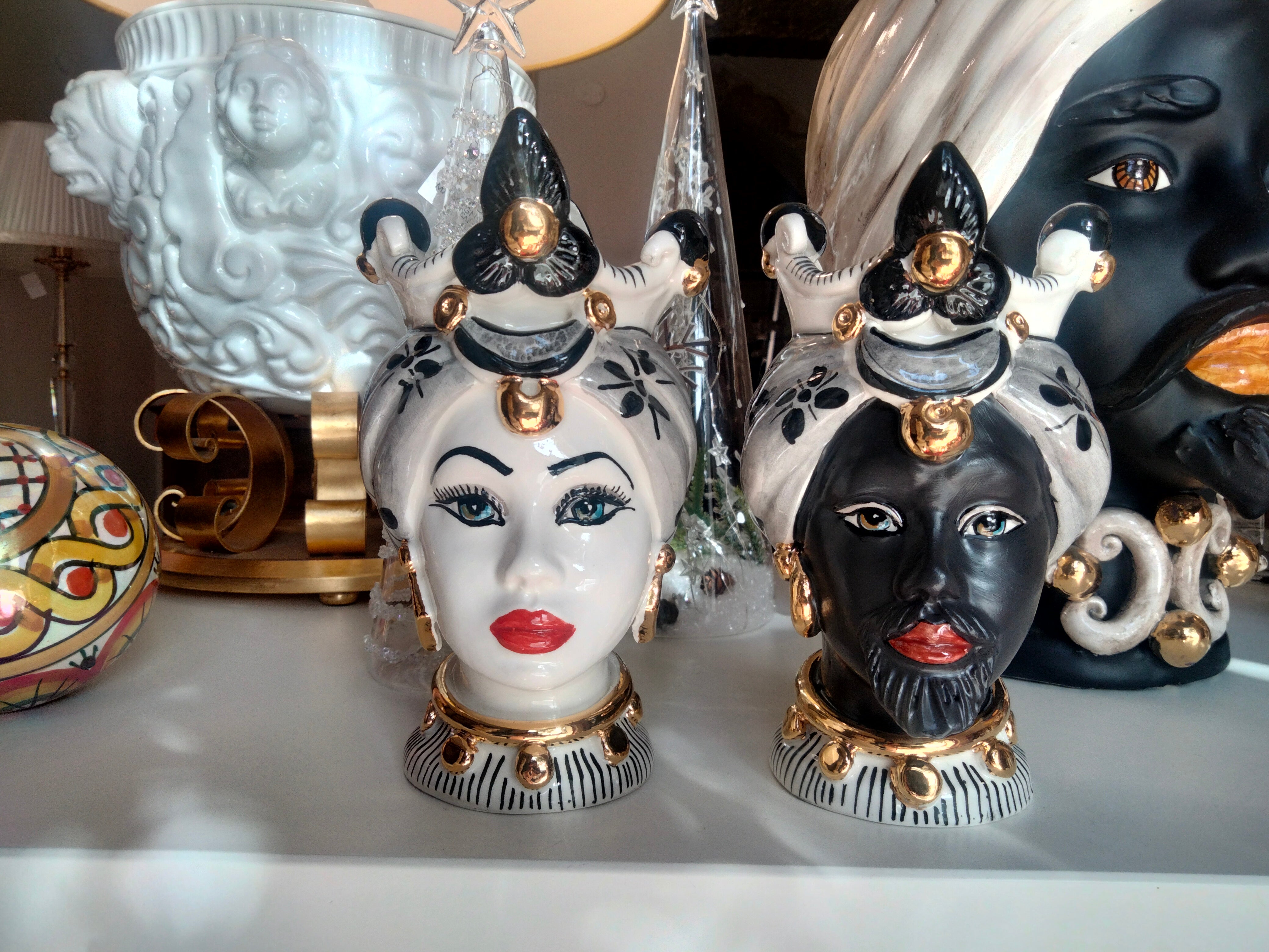 Pair of Moorish heads with black and pure gold decoration