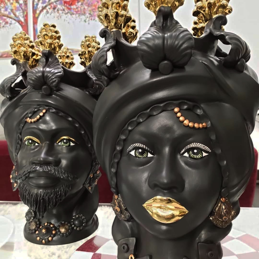 Pair of black Moor's heads and pure gold