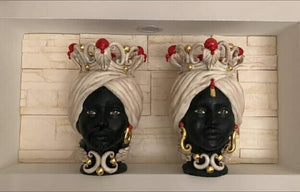 Pair of dark brown heads with red knobs