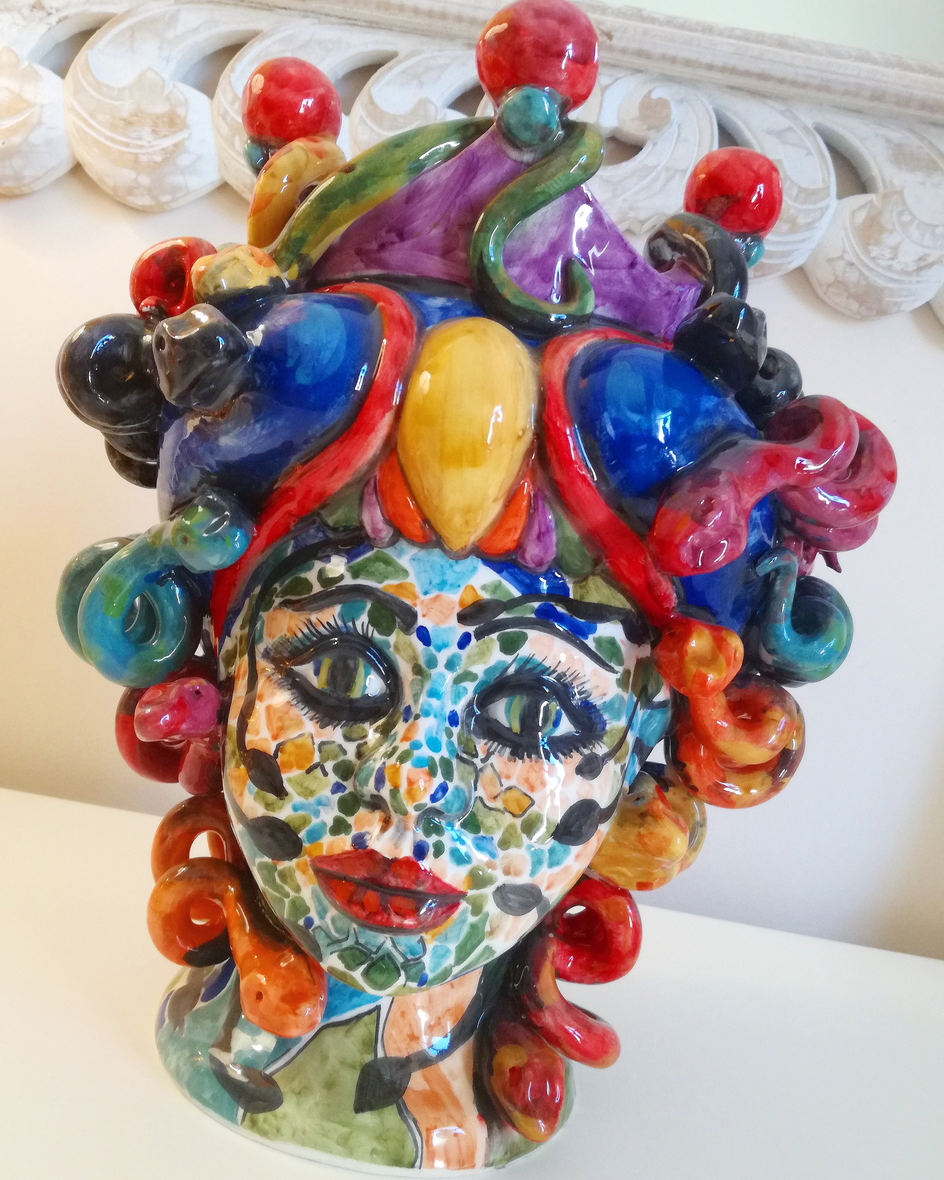 Medusa head with mosaic effect face