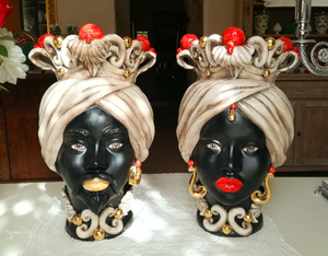 Pair of dark brown heads with red knobs and pure gold details