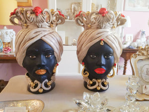 Pair of dark brown heads with red knobs and pure gold details